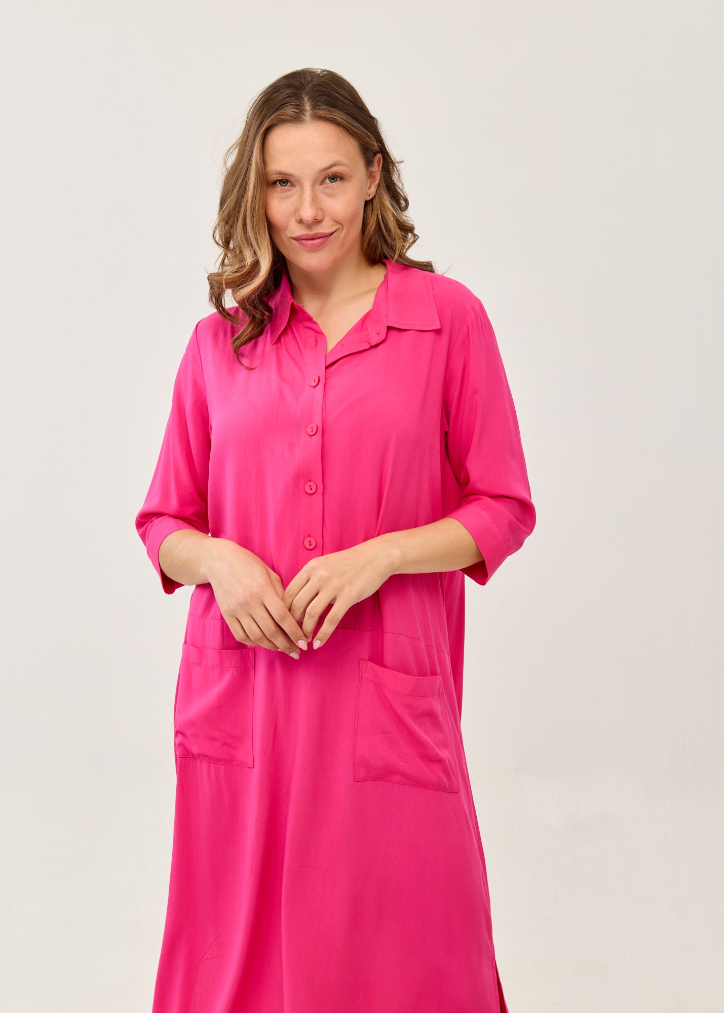 Fuchsia dress with a partial button placket and square pockets