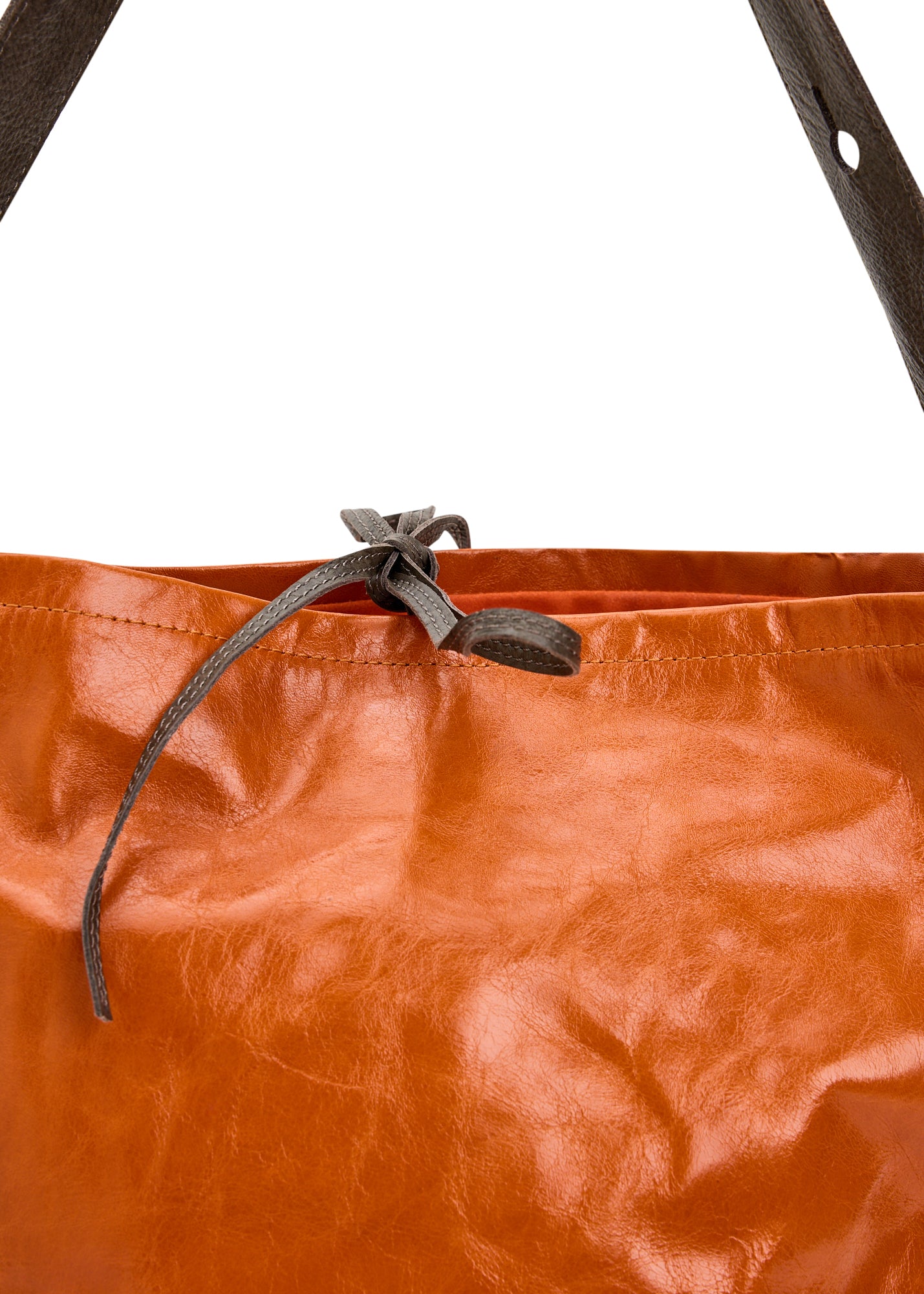 Leather bucket bag with orange button strap