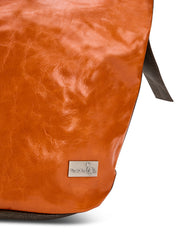 Leather bucket bag with orange button strap