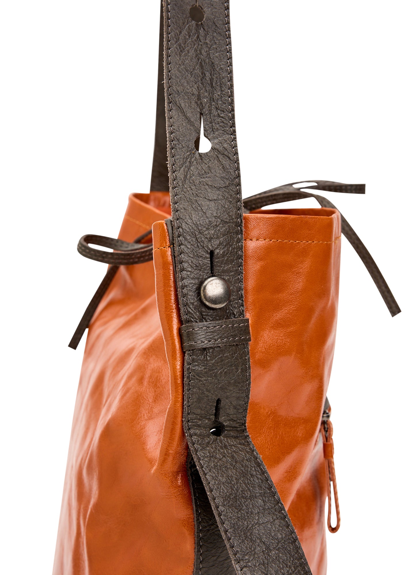 Leather bucket bag with orange button strap