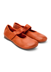 Ballet flats with an orange strap across the top