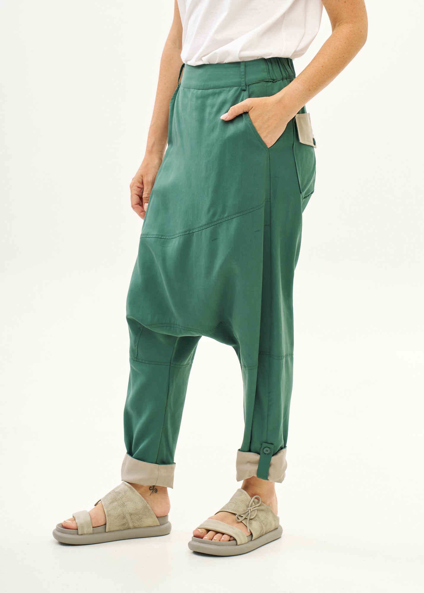 Green trousers with pleats, color combination, fold at the hem