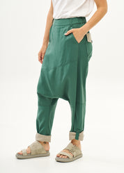 Green trousers with pleats, color combination, fold at the hem