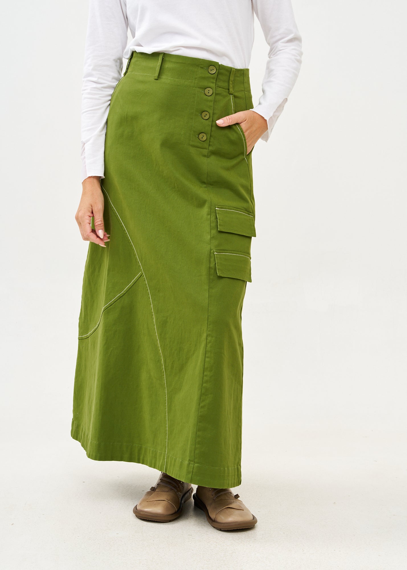 Asymmetrical cut skirt with prominent stitching in green