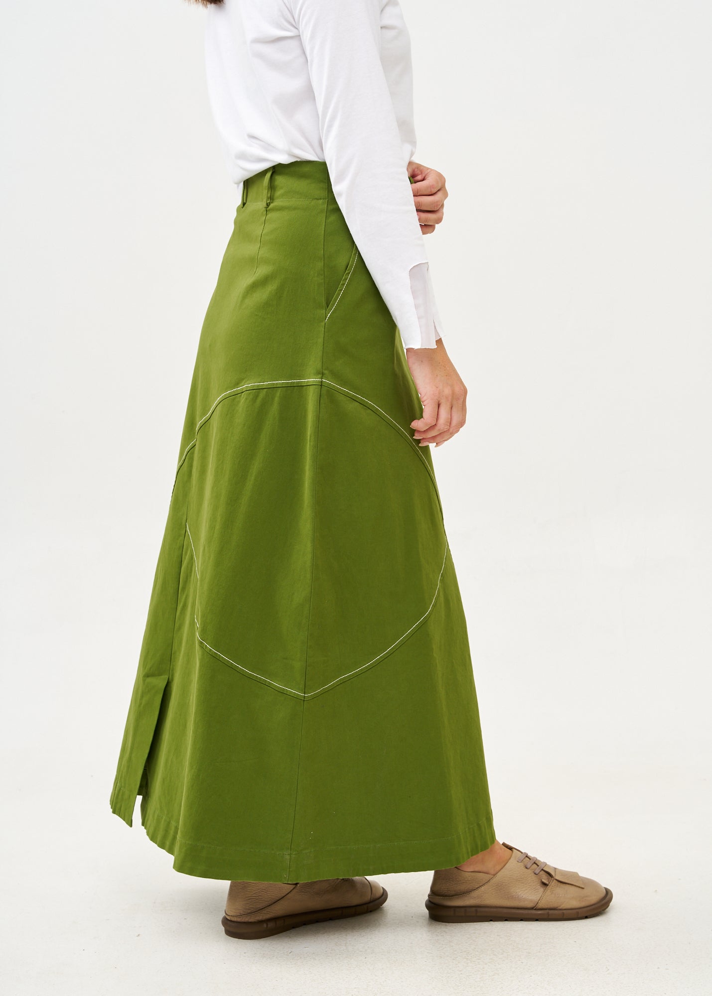 Asymmetrical cut skirt with prominent stitching in green