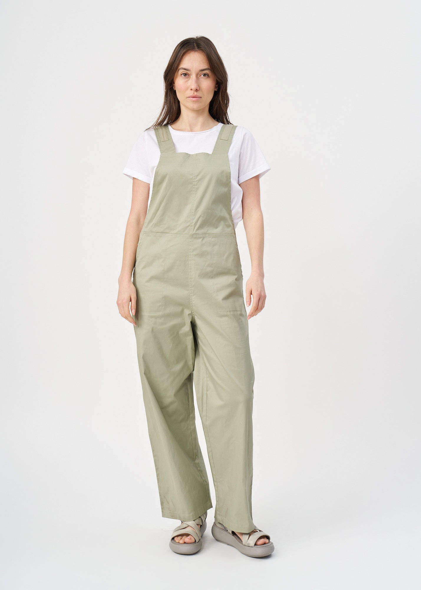 Suspender jumpsuit with green ribbon