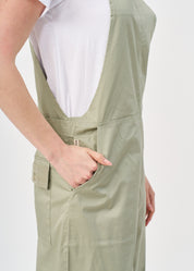 Suspender jumpsuit with green ribbon
