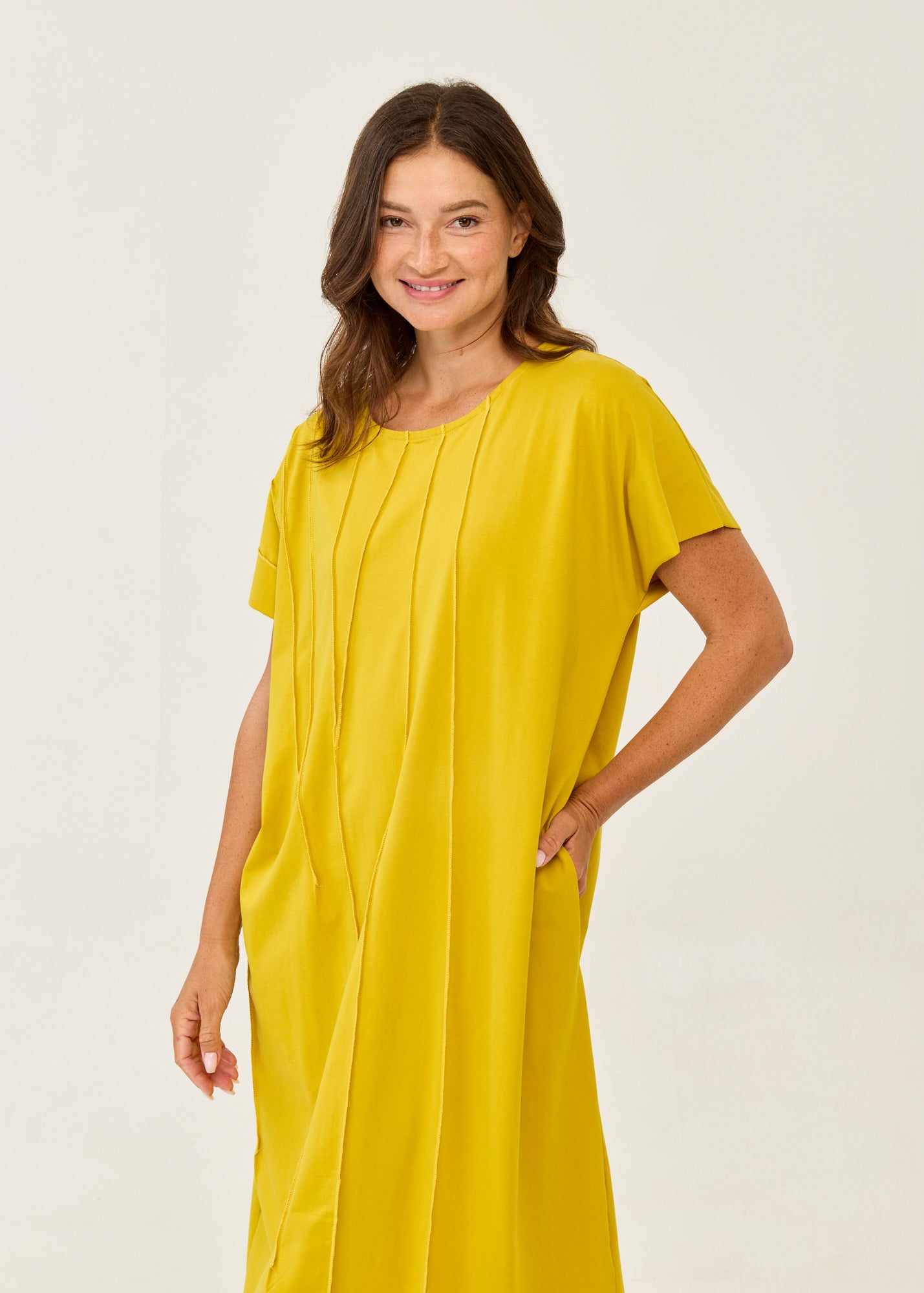 Mustard short-sleeve dress with prominent seams