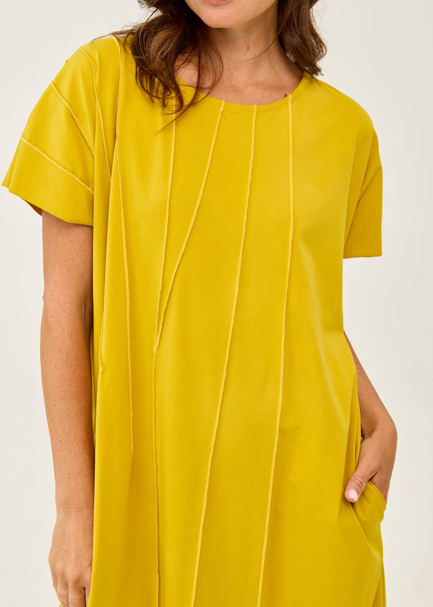 Mustard short-sleeve dress with prominent seams