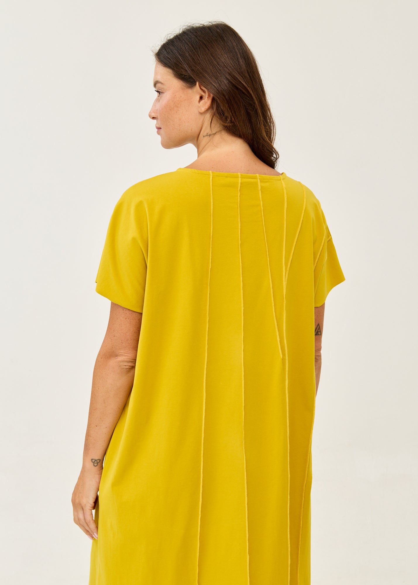 Mustard short-sleeve dress with prominent seams