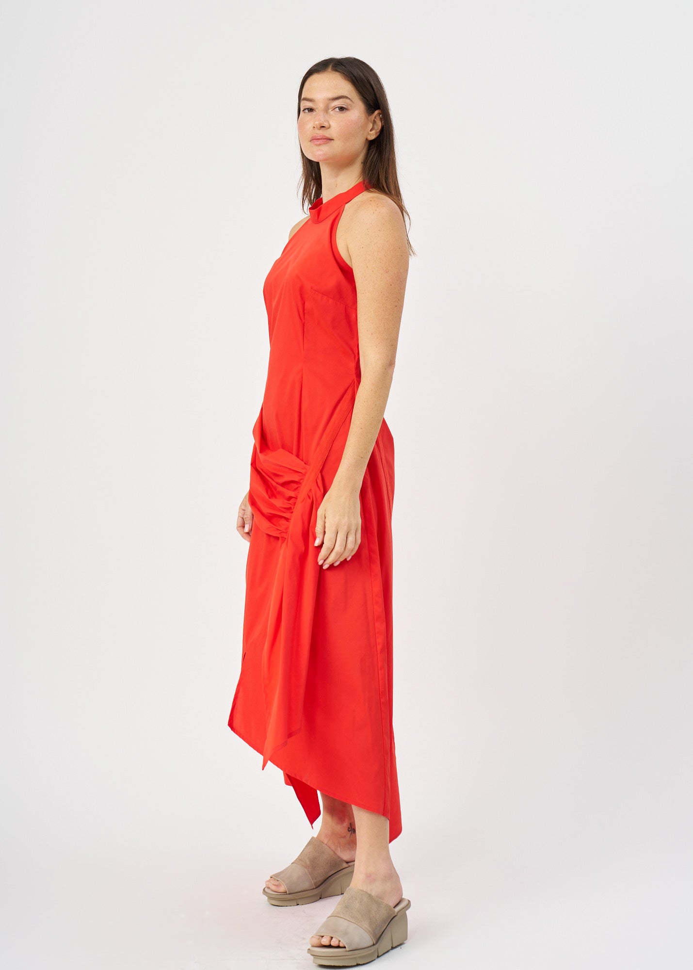 Halter neck dress with gathers and a red ribbon