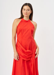Halter neck dress with gathers and a red ribbon