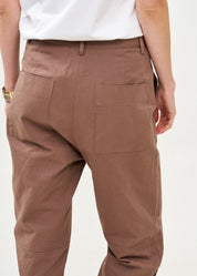Long pants with brown diagonal belt
