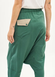 Green trousers with pleats, color combination, fold at the hem