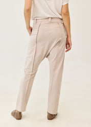 Pants with button and zipper cutouts, Stone