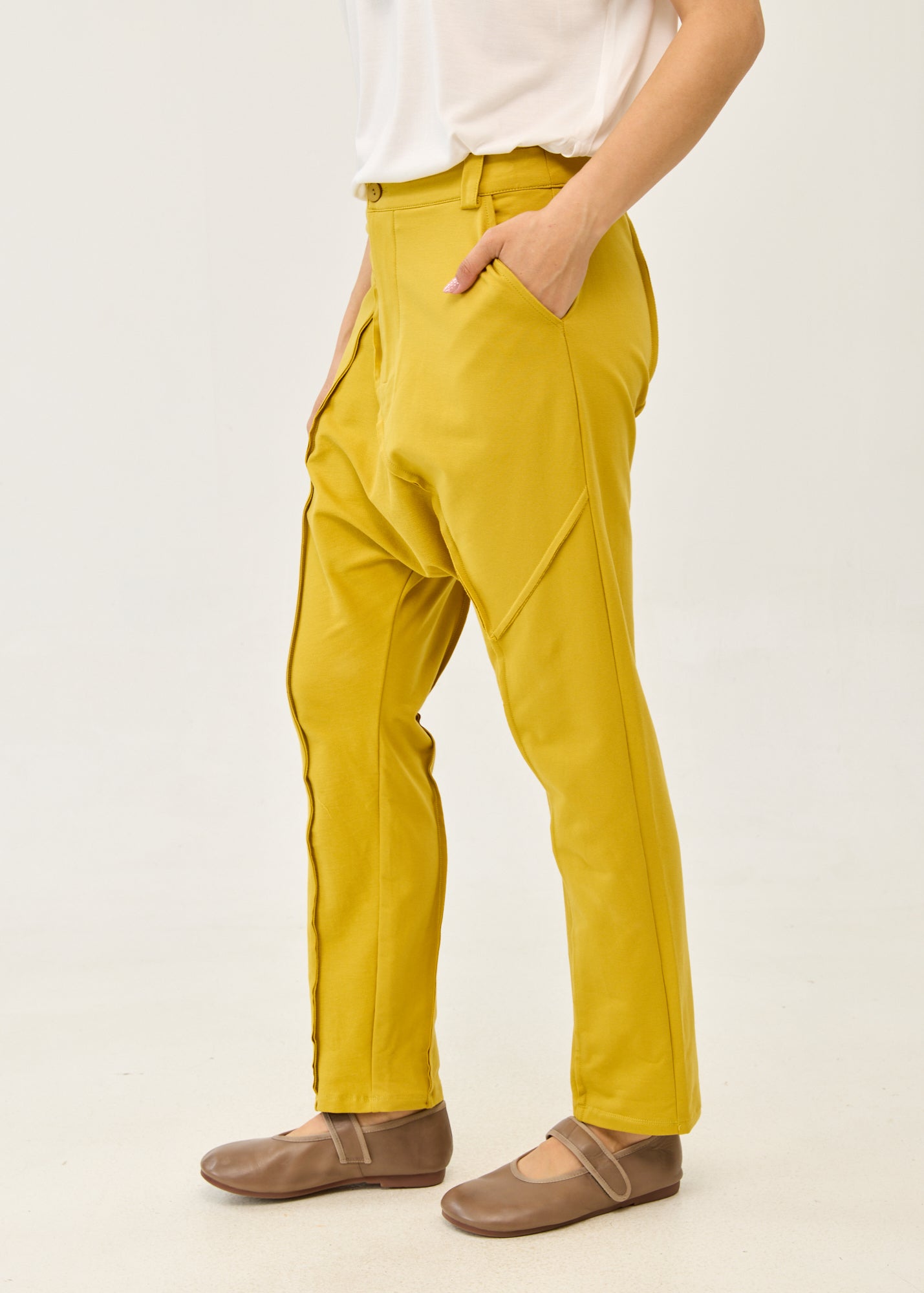 Pants with cutouts, button, and mustard zipper