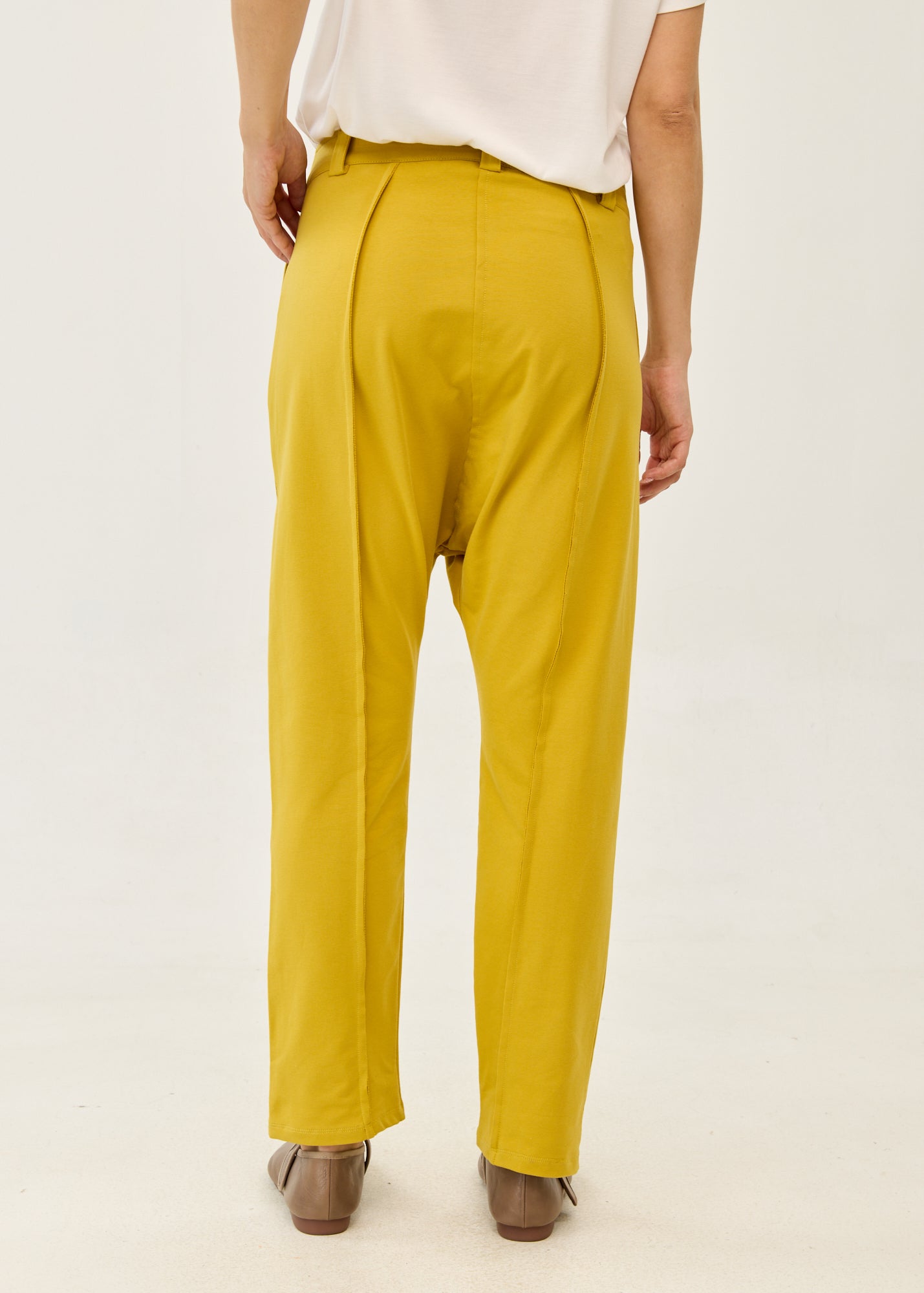 Pants with cutouts, button, and mustard zipper
