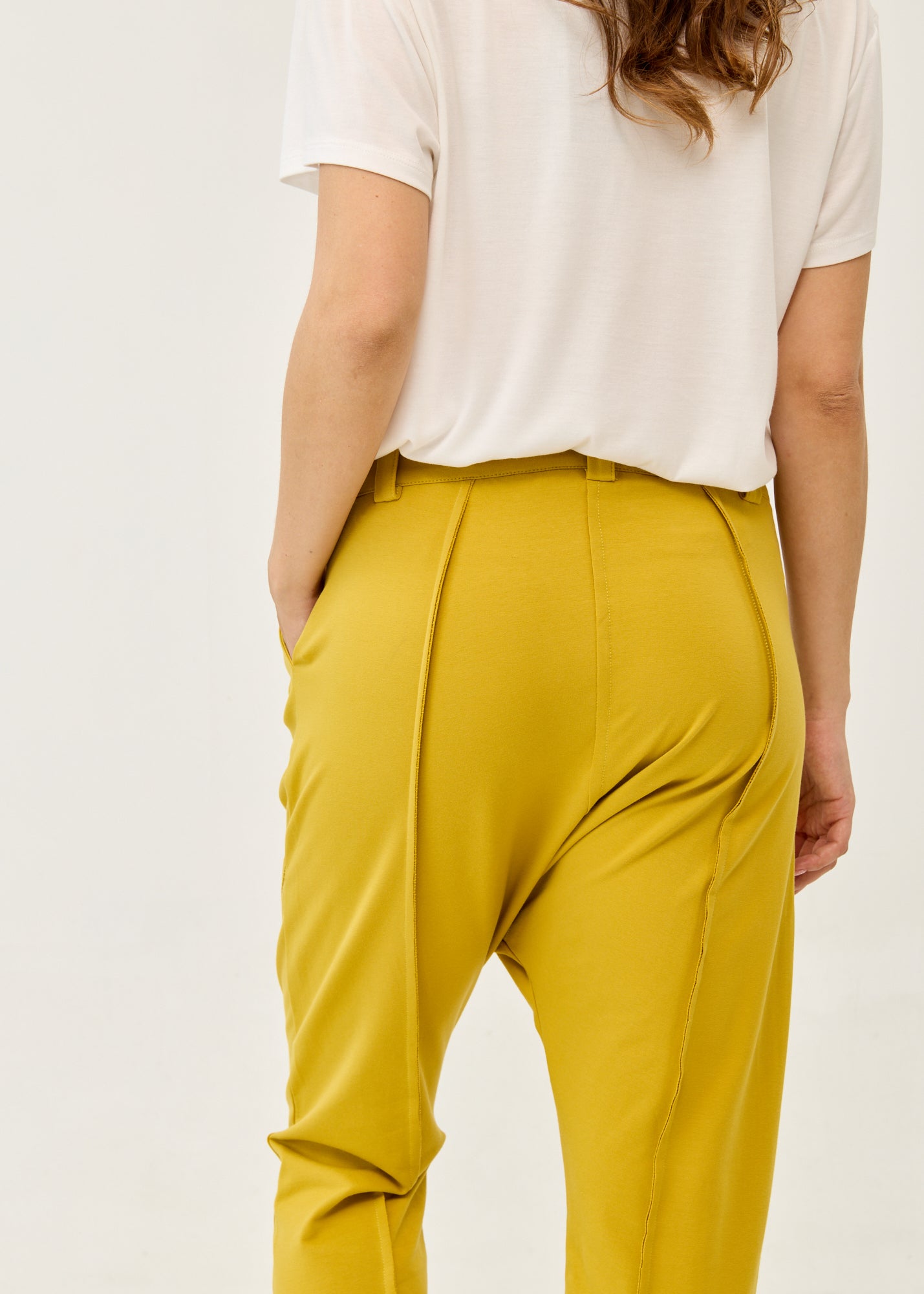 Pants with cutouts, button, and mustard zipper