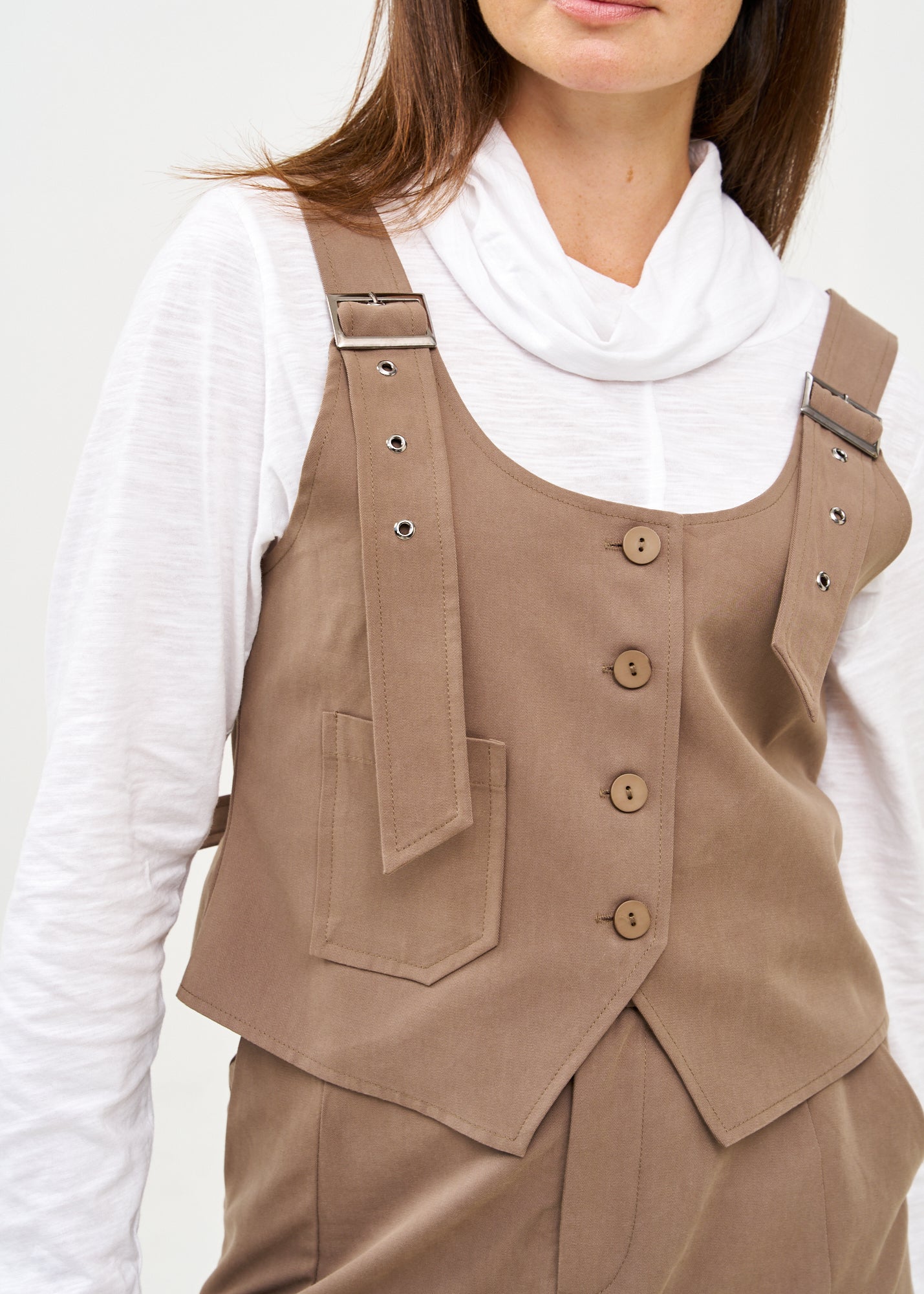 Brown buckled suspender vest