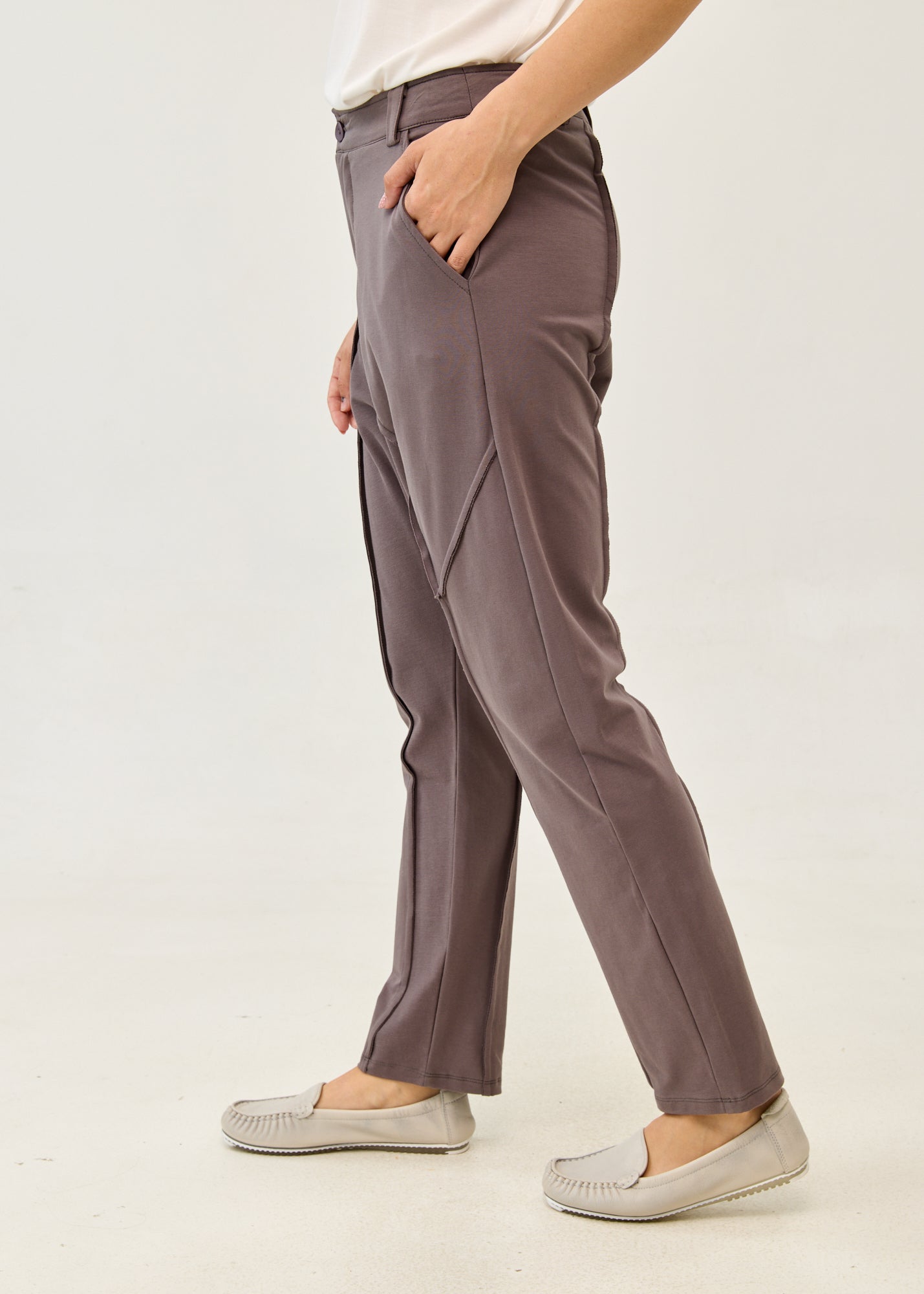 Dark gray pants with button and zipper cut-outs