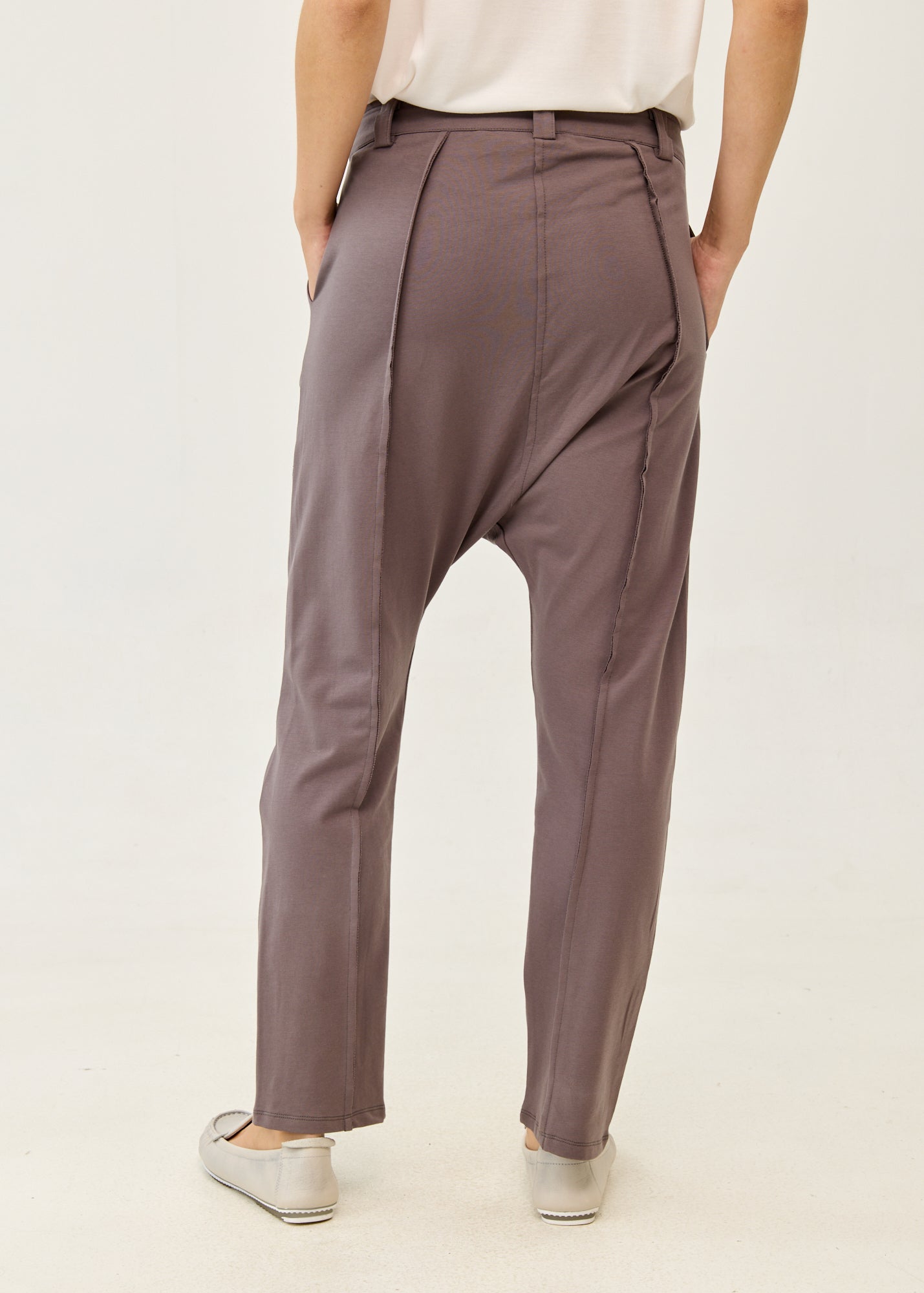 Dark gray pants with button and zipper cut-outs