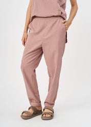 Pleated twill fabric pants with pink hem