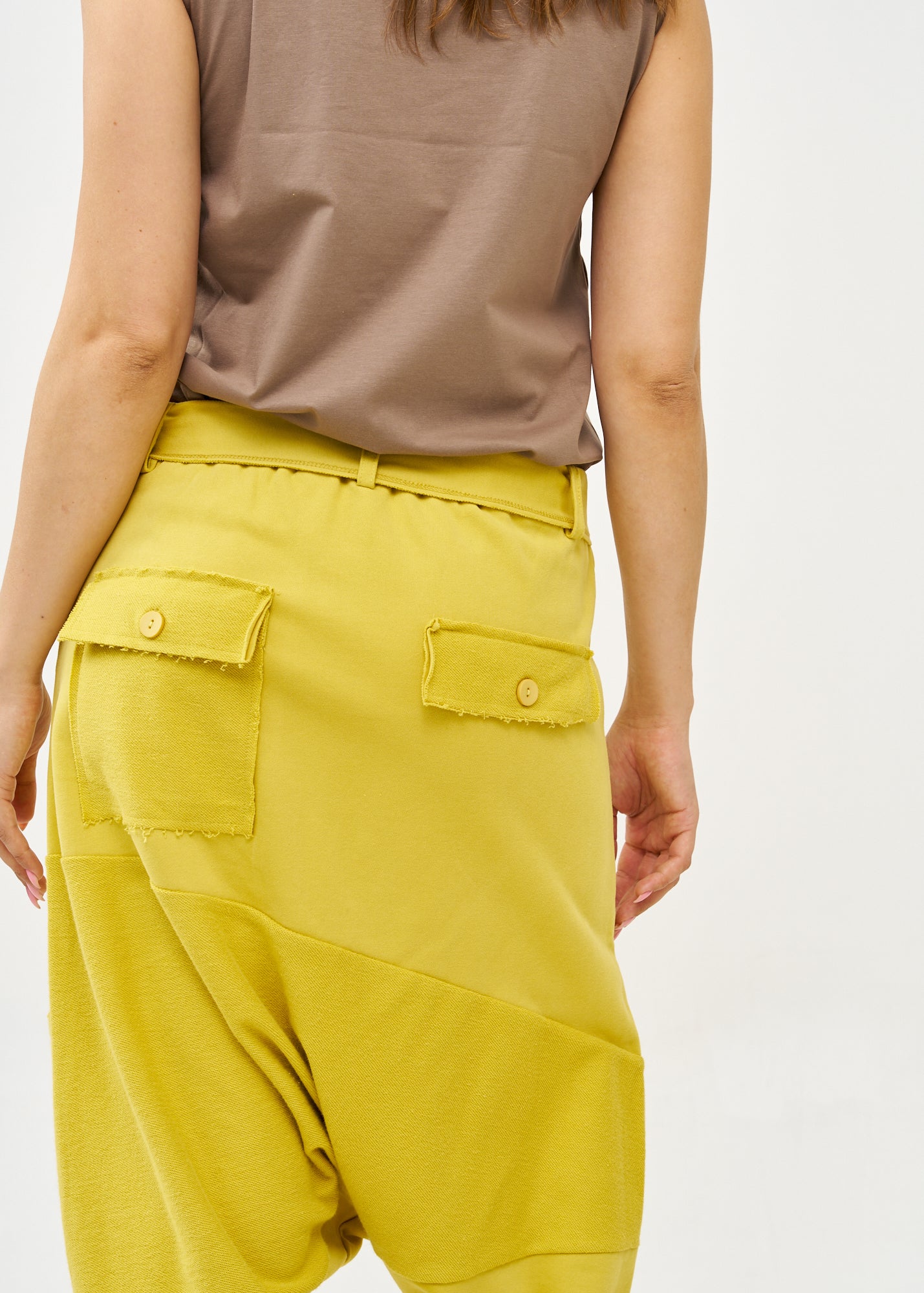 Reverse cut baggy pants with mustard belt