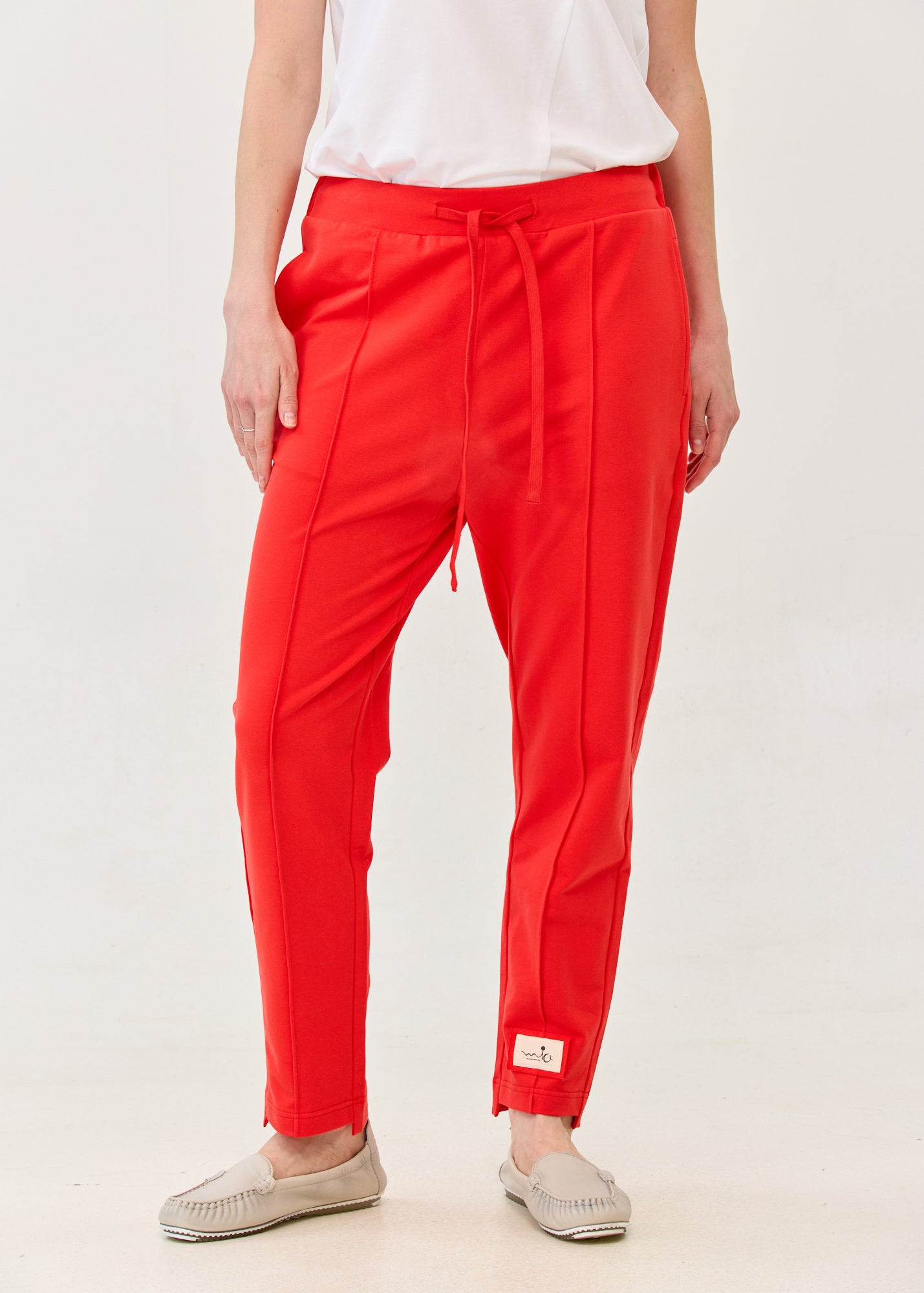 Pants with a seam in the middle and a red patch