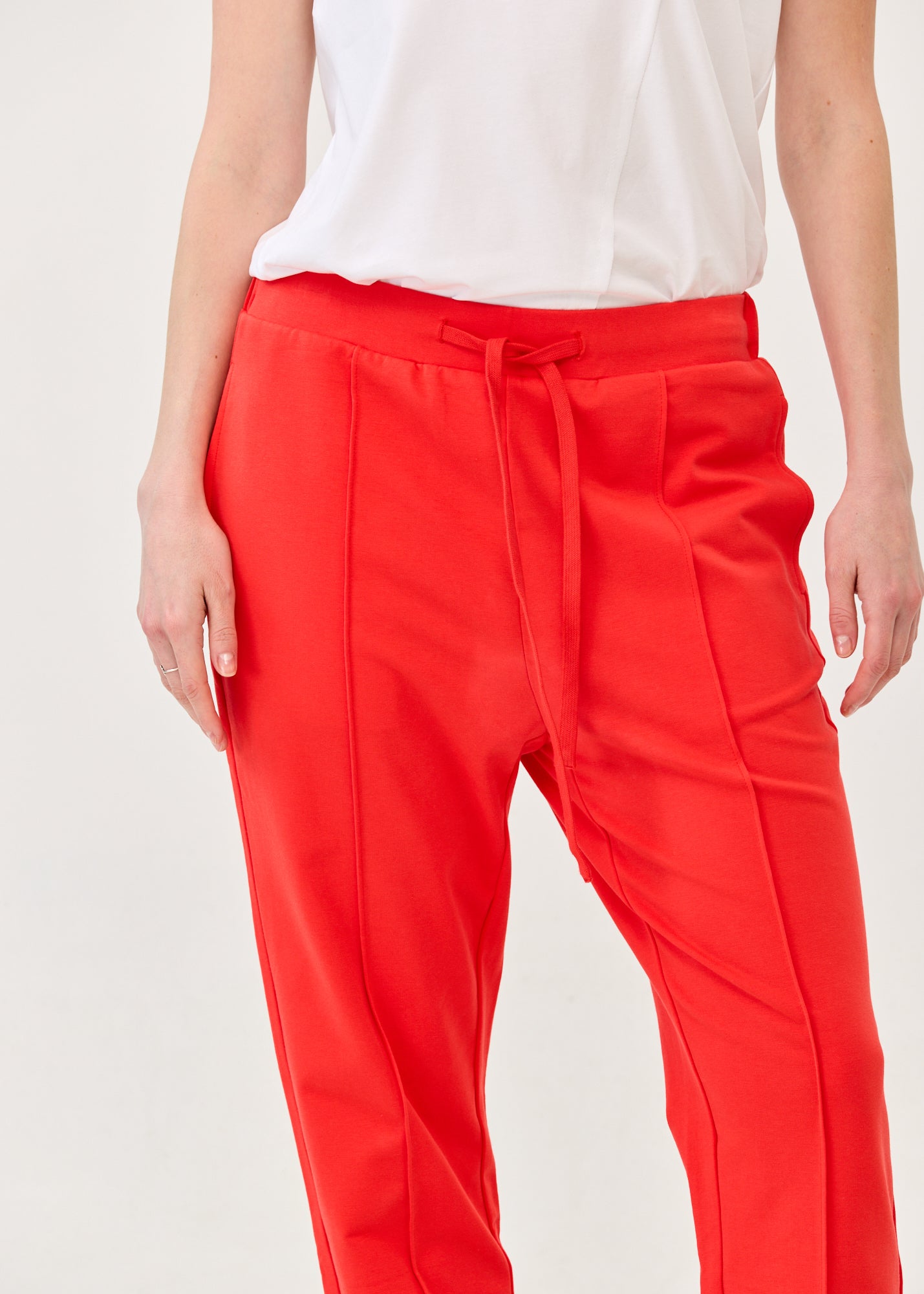 Pants with a seam in the middle and a red patch