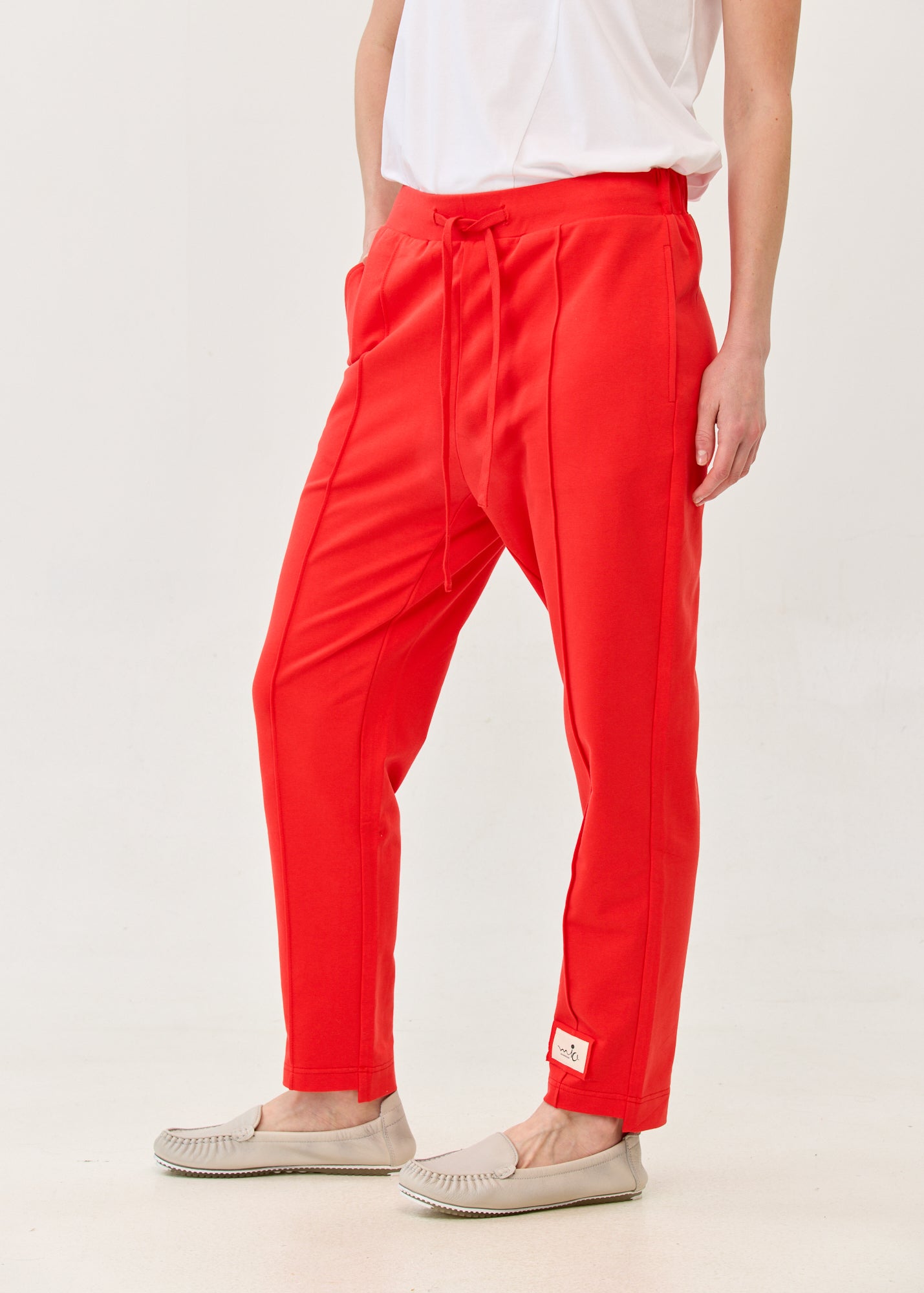 Pants with a seam in the middle and a red patch