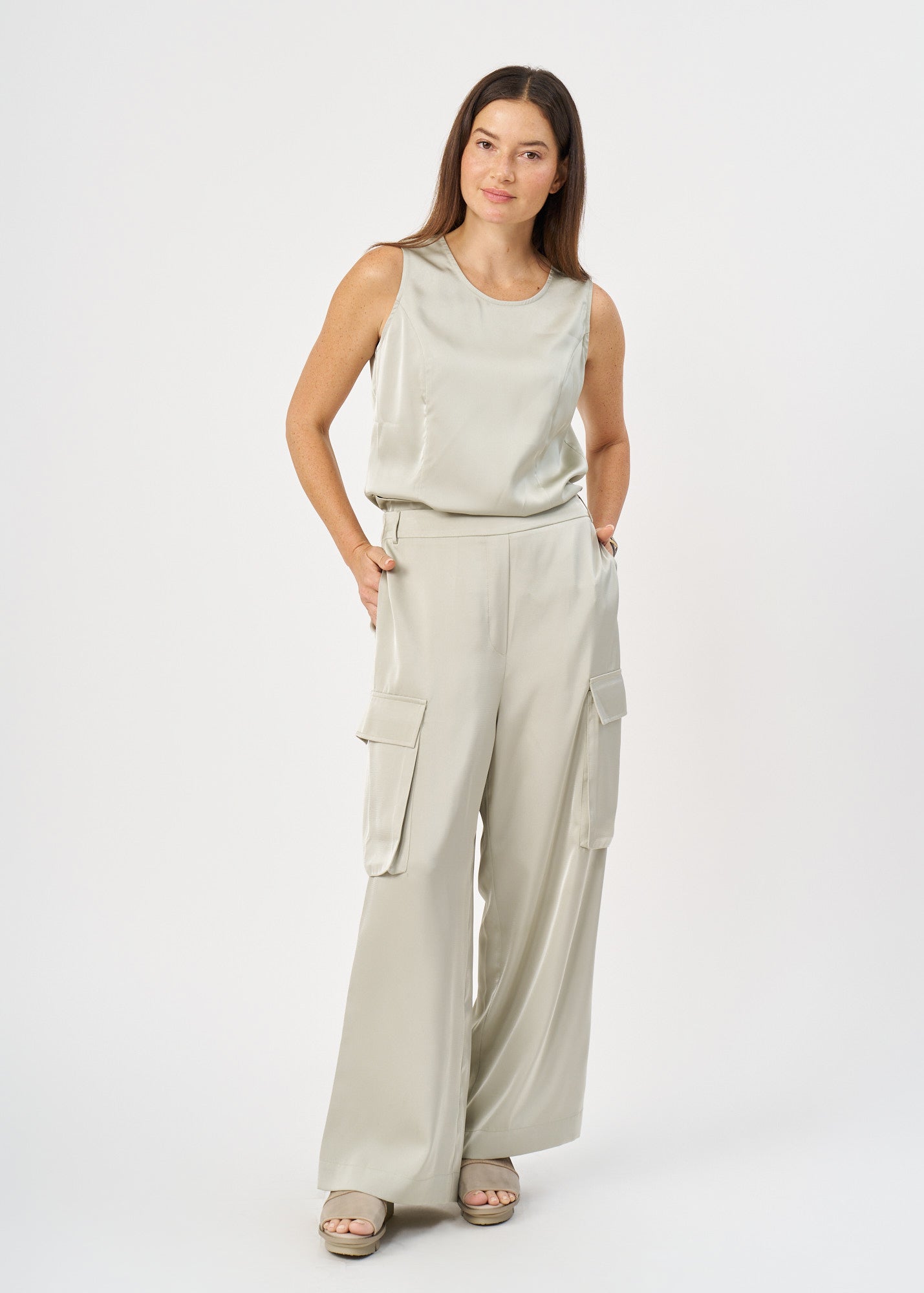 Green satin pants with pockets