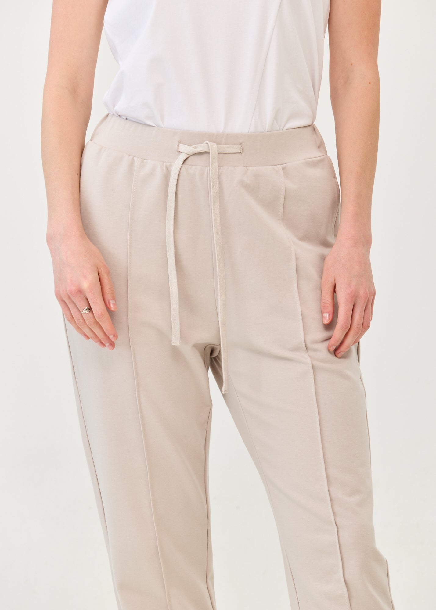 Pants with a seam in the middle and a stone patch