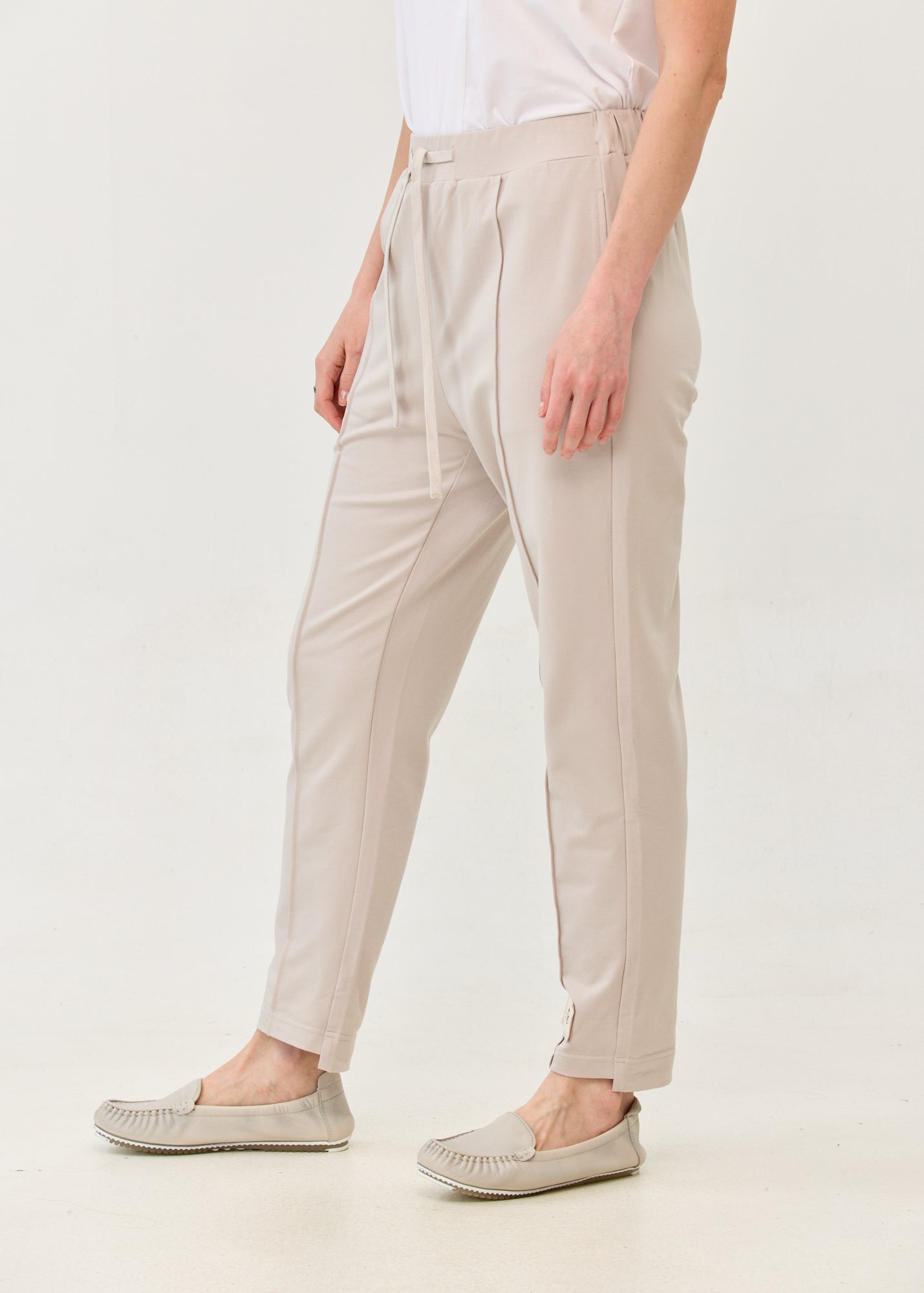 Pants with a seam in the middle and a stone patch