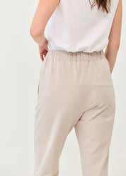 Pants with a seam in the middle and a stone patch