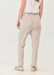 Pants with a seam in the middle and a stone patch