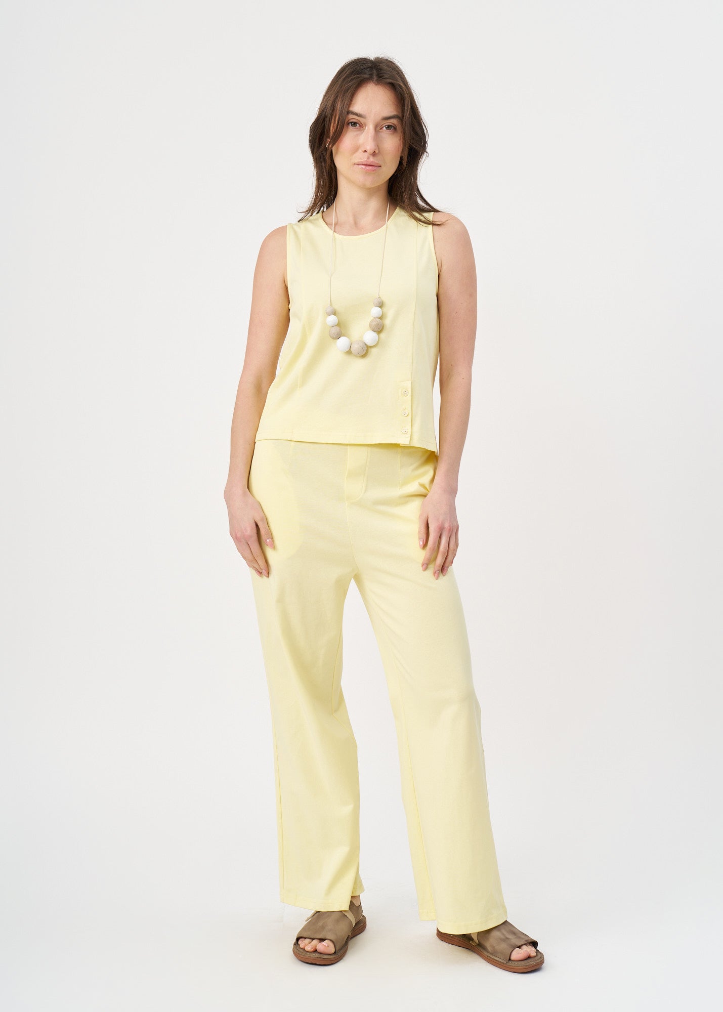Yellow jersey tank top with slit at the hem