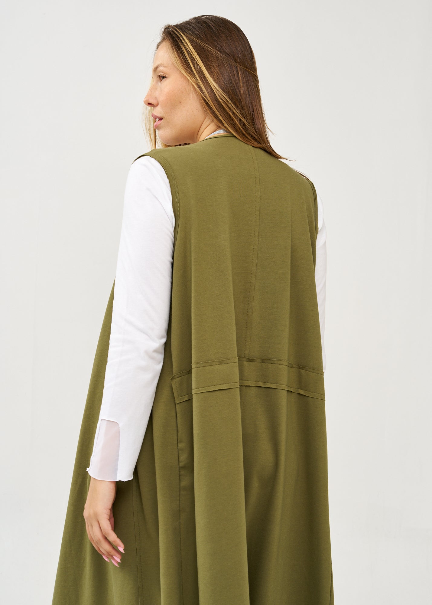 Long sleeveless top with green drawstring