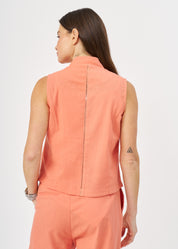 Orange vest with a combination of ladder ribbon and buttons