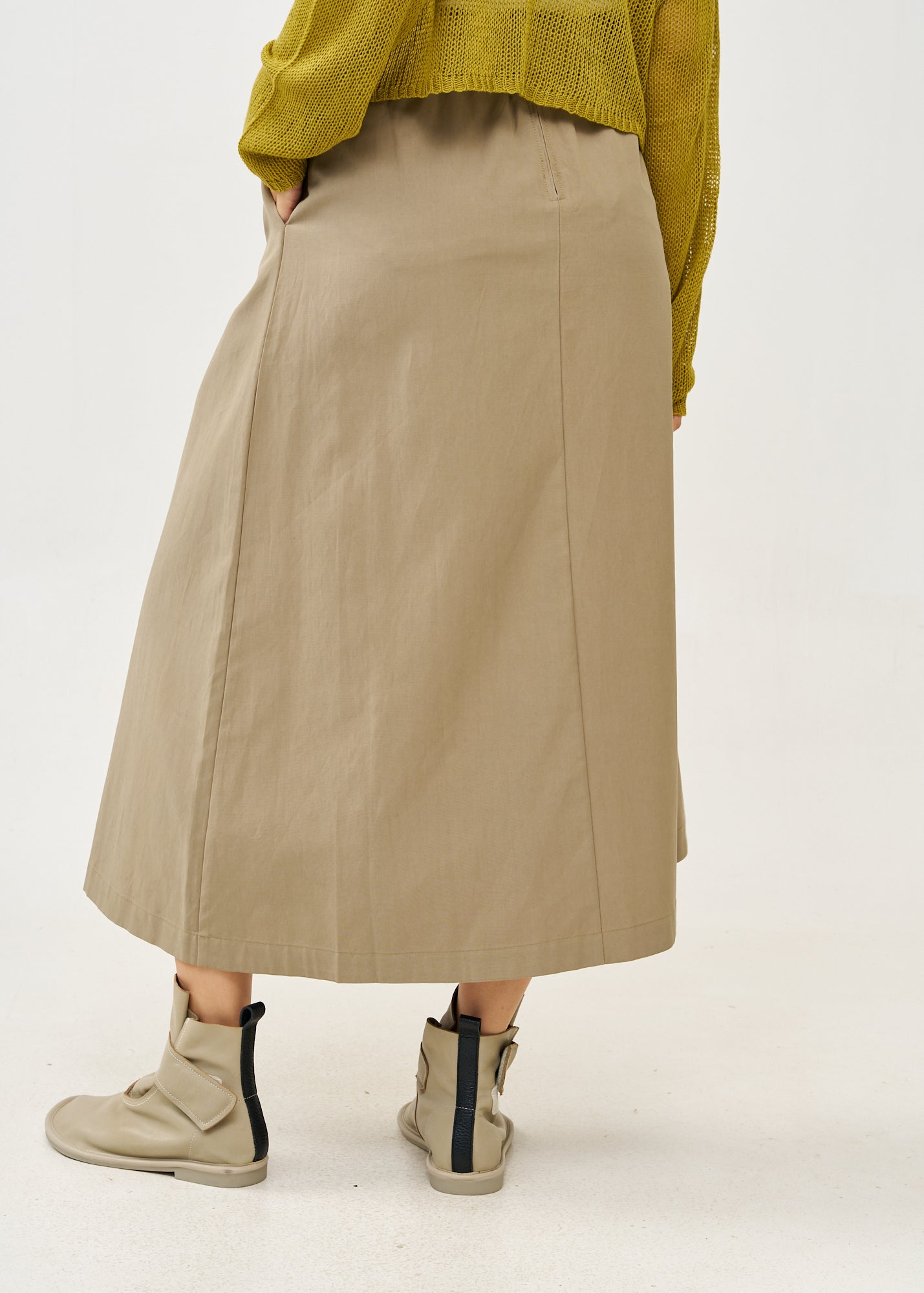 Asymmetrical wrap skirt with brown belt
