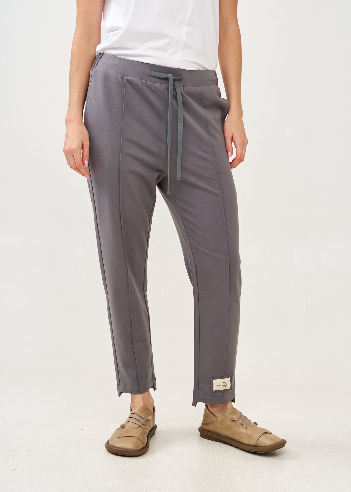 Pants with a seam in the middle and a dark gray patch