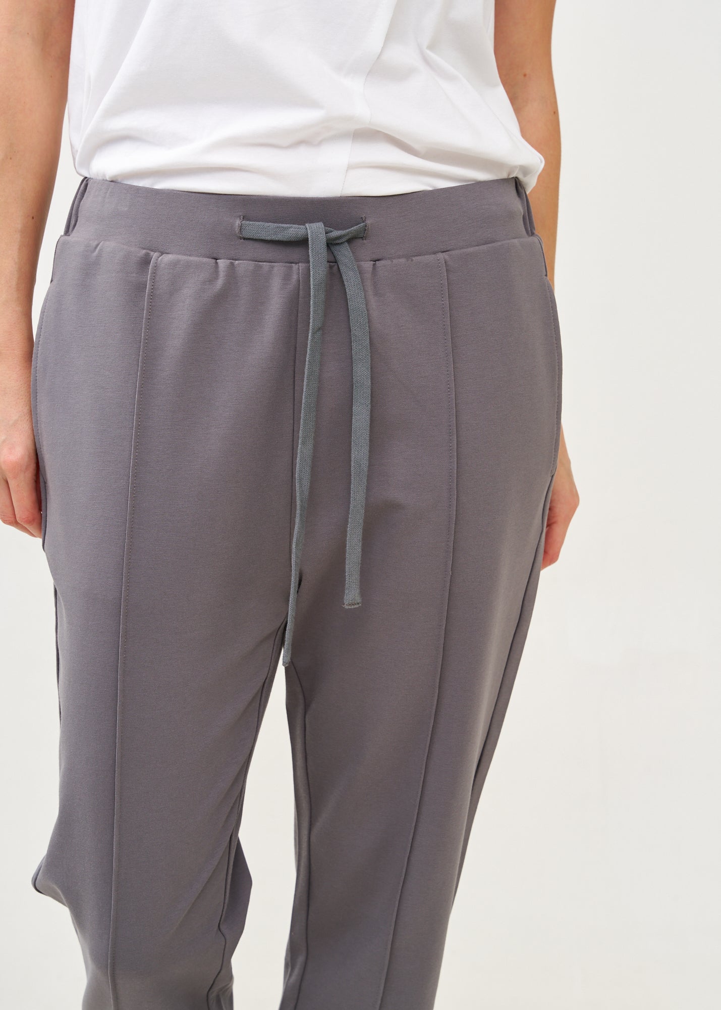 Pants with a seam in the middle and a dark gray patch