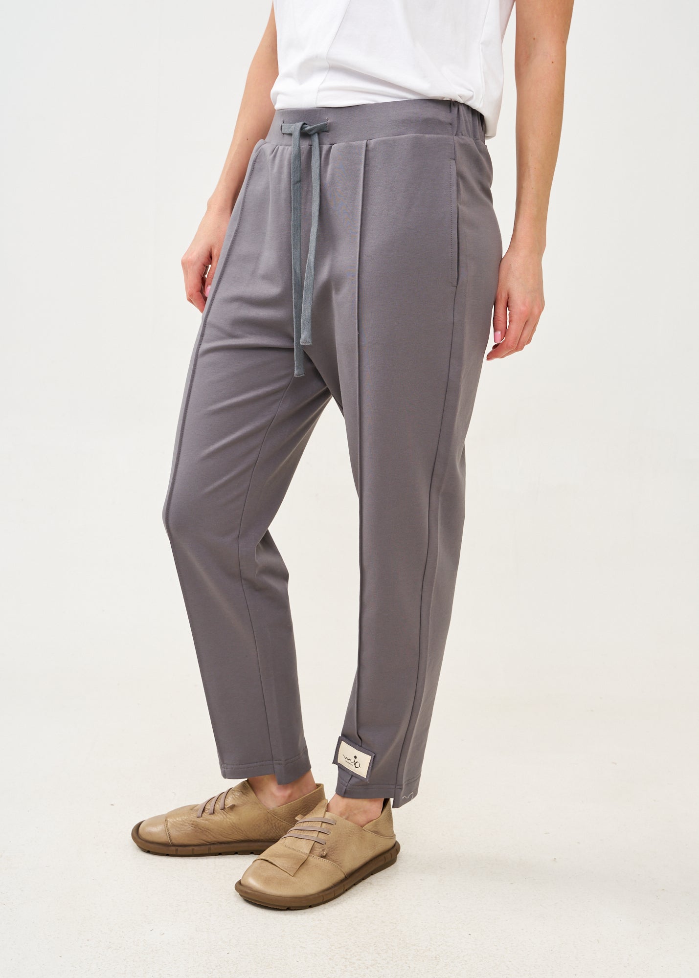 Pants with a seam in the middle and a dark gray patch