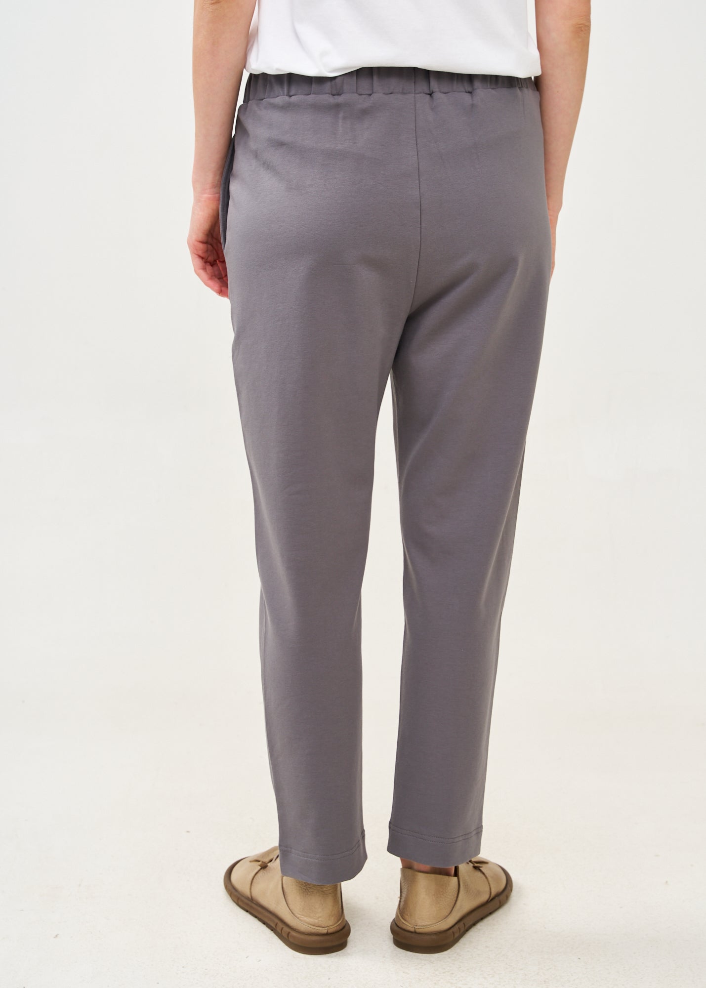 Pants with a seam in the middle and a dark gray patch