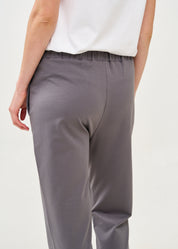 Pants with a seam in the middle and a dark gray patch