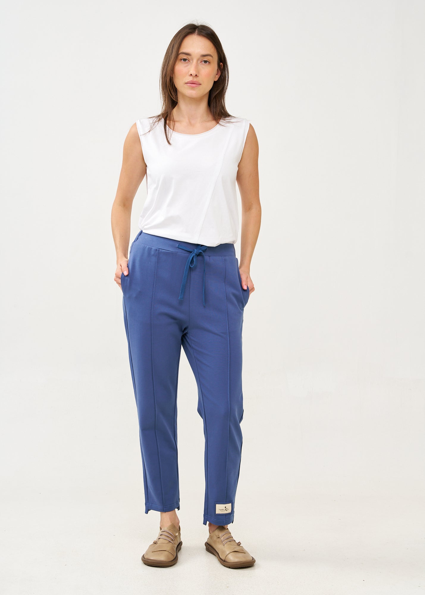 Pants with a seam in the middle and a dark blue patch