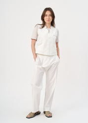Folded pocket vest with white button