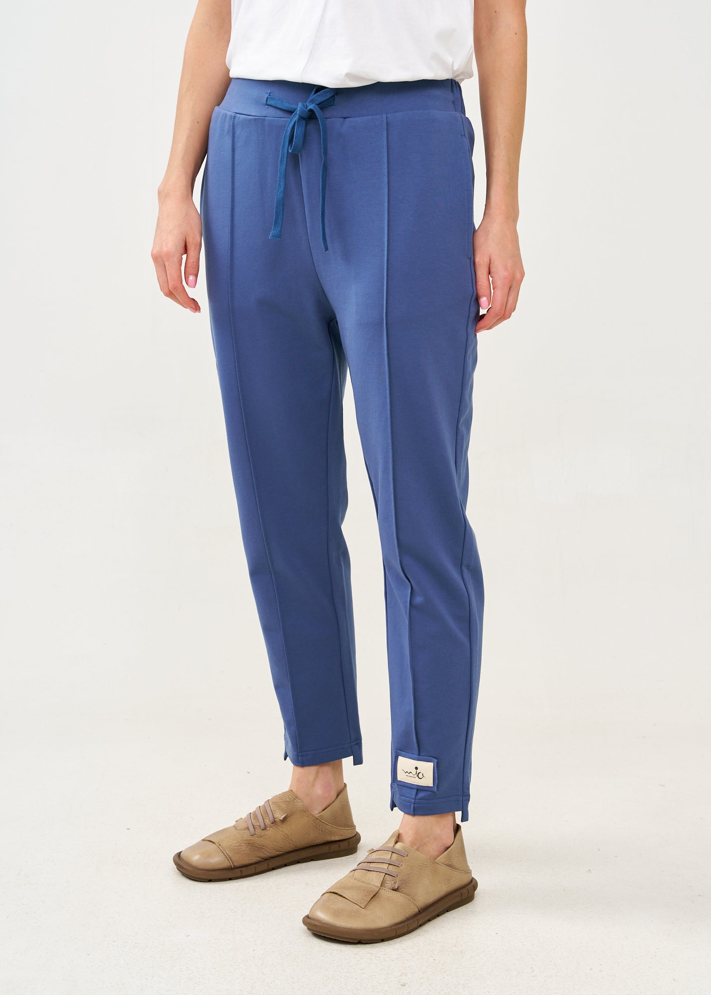 Pants with a seam in the middle and a dark blue patch