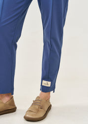 Pants with a seam in the middle and a dark blue patch