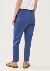 Pants with a seam in the middle and a dark blue patch