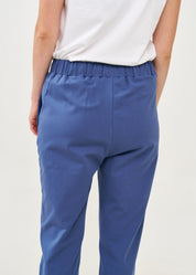 Pants with a seam in the middle and a dark blue patch
